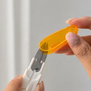 Portable thread scissors with safety cap, ideal for fishing, cross stitch, and crafts.