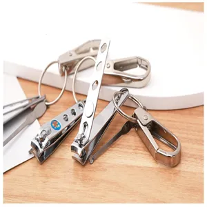 Multi-functional metal nail clipper keychain and ear pick detail view for daily use.