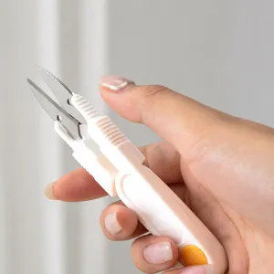 Portable plastic fishing line scissors with protective cap, non-slip handle craft yarn thread cutter.