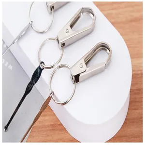 Portable metal keychain with ear pick tool, durable everyday carry accessory for cleaning.