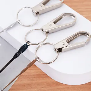 Metal keychain with portable ear pick tool, sturdy metal keyring for daily use and care.