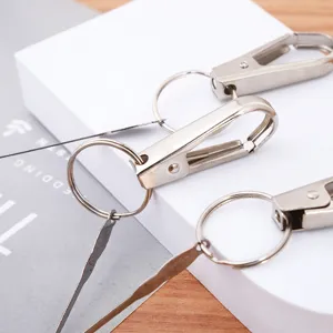 Portable metal keychain with built-in ear pick tool, durable key ring for daily use and travel.