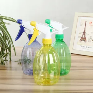 Plastic manual pressure garden spray bottle, colorful plant watering pot for home gardening.