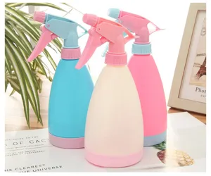 Plastic pressure watering spray bottle for plants, large 1.5L capacity, pastel colors.