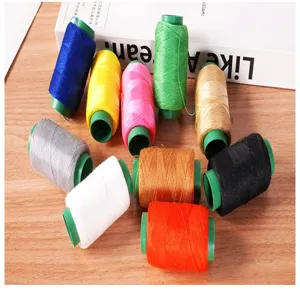 Detailed view of colorful sewing thread spools for garment repair and craft work.