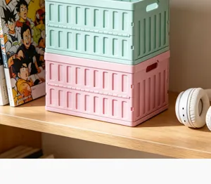 Detailed view of stackable foldable plastic storage baskets in green and pink colors.