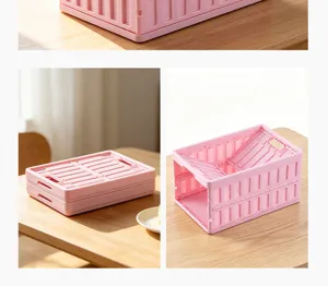 Pink plastic folding storage crate detail view, portable organizer basket for home or car.