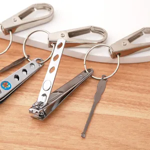 Metal nail clipper keychain with ear pick and carabiner ring, durable steel tool.