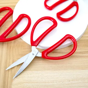 Stainless steel household scissors with red handle, multi-functional cutting tool.