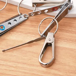 Portable stainless steel nail clipper with keyring, ear pick and hook, practical daily tool.