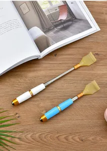 Detailed view of the retractable back scratcher, featuring telescopic metal rod and durable claw.