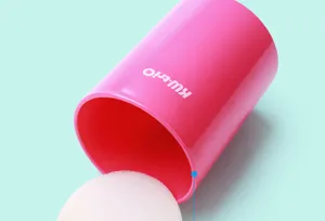 Pink plastic pen holder detail showing the inner sponge cushion and smooth cylindrical design.