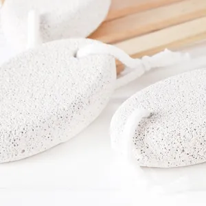 Natural volcanic pumice stone with hanging rope for foot dead skin removal and heel care.