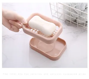 Double layer plastic soap dish with drainage grid for bathroom travel portable use pink color.