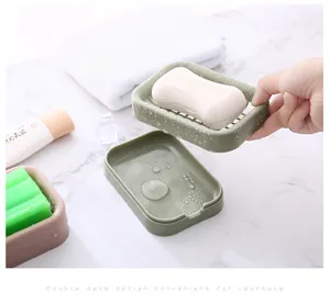 Double deck plastic soap dish detail view, efficient drainage mesh design for bathroom use.