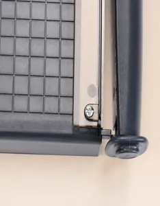 Portable A4 paper cutter detail view showing safety lock design and operation instructions.