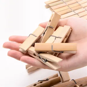 Natural wooden clothespins with sturdy metal spring, perfect for hanging clothes and socks securely.