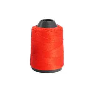 Red polyester sewing thread spool, durable cone thread for hand and machine stitching.