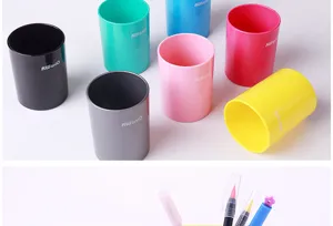 Colorful plastic pen holder desk organizer with sponge base for office stationery storage.