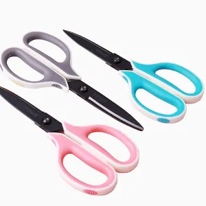 Multipurpose office scissors with ergonomic dual-color handles and sharp black steel blades.