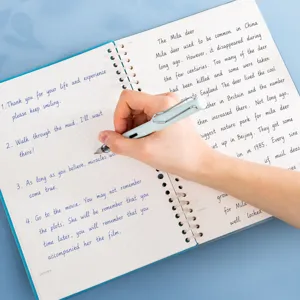 6-hole loose leaf binder ring notebook with grid paper for daily planning and creative writing.