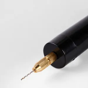 Mini electric drill metal chuck nut and stainless steel spindle close-up view for precise DIY crafting.
