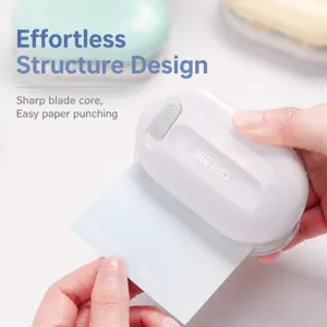 Mini office hole puncher for planners and DIY crafts with sharp blades and lock design.