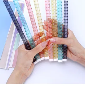 Colorful transparent plastic loose leaf binder rings for notebook planning and office binding.