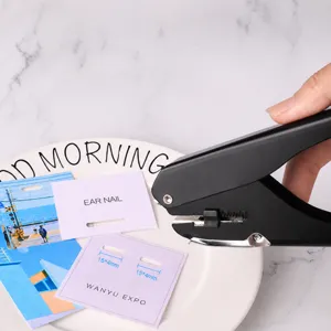 Heavy duty metal oval hole puncher for ID cards, badges, and paper with precise cutting action.
