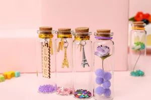 Creative glass drifting wishing bottle set with Eiffel tower charms for romantic birthday gifts.