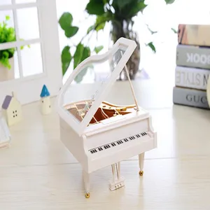 Mini white grand piano music box model, exquisite desktop ornament and jewelry storage box.