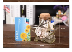 Botella de deseos de vidrio en forma de estrella creativa con corcho y dije de la Torre Eiffel.