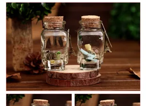 Detail view of clear glass wishing bottles with cork stoppers and cute Eiffel Tower charms.