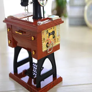 Vintage sewing machine music box, retro home decor collectible creative gift item.