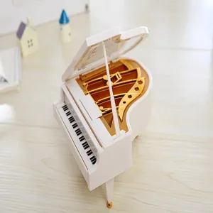 Miniature grand piano music box detail, exquisite white and gold design for home decor and gifts.