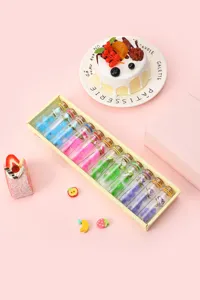 Detailed view of colorful glass drift wish bottles set with pom poms in a gift box packaging.