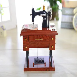 Vintage retro sewing machine music box detail view, classic wood grain finish decor.
