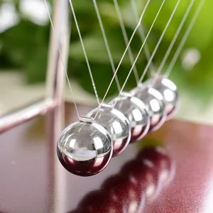 Classic Newton's Cradle balance balls physics science desk toy for home office decor.