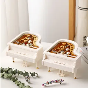 Mini white piano music box jewelry storage container creative desktop home decor gift item.