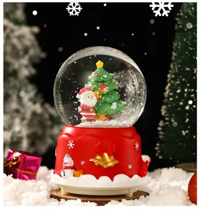 Wunderschöne Weihnachts-Schneekugel Spieldose mit leuchtendem Baum und Nikolaus Detail.