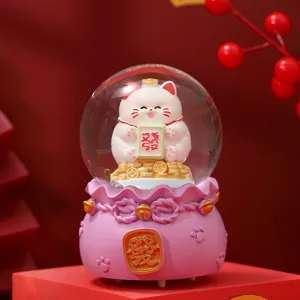 Festive glowing lucky cat crystal ball desktop decoration, perfect New Year gift and decor.