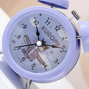 Detailed view of purple cartoon metal alarm clock with cute anime character dial and twin bells.