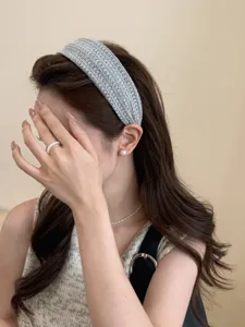 Elegant grey woven wide headband shown on model for high skull top effect