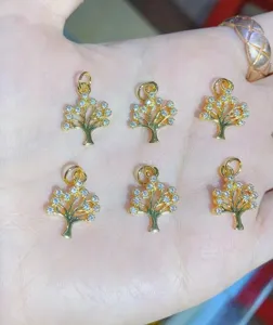 Gold plated cubic zirconia tree of life charms, delicate jewelry making pendant detail view.