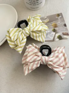 Coppia di pinze per capelli a righe con fiocco in verde e rosa pastello