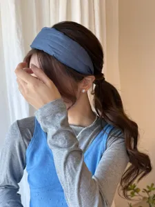 Elegant minimalist blue fabric wide headband shown on an Asian model detail view