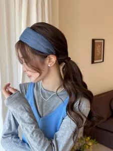 Detailed side view showing a stylish Korean style blue fabric wide headband for women.