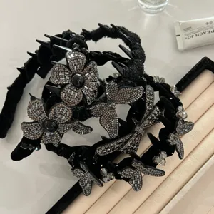 Luxurious black velvet rhinestone butterfly and flower headbands with teeth comb.