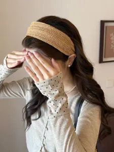 Detail view of a woven wide headband on an Asian model for high skull top effect