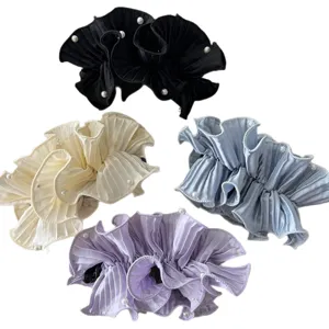 Four elegant pleated satin banana hair clips with pearl details in assorted colors